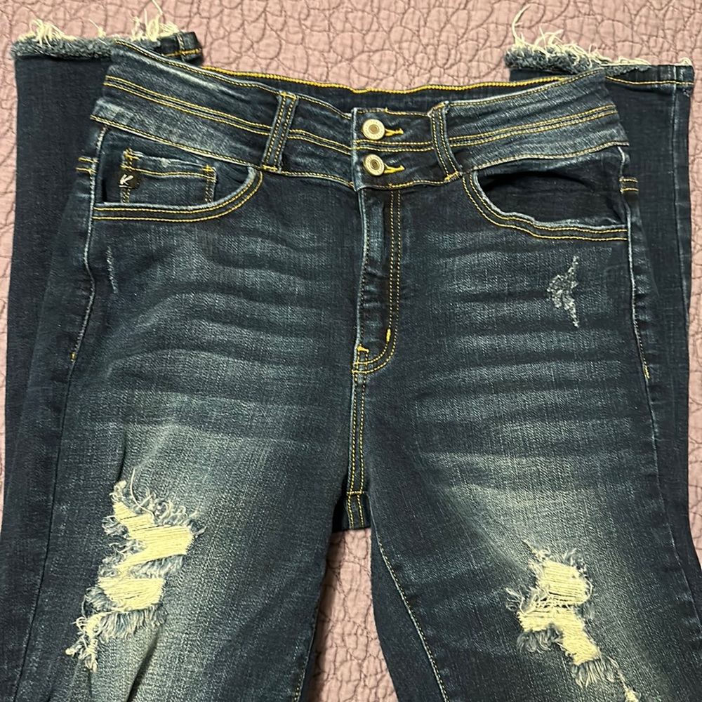 Distressed skinny jeans.